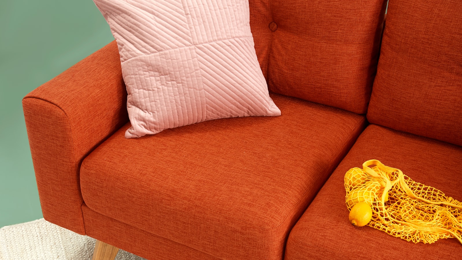 Person napping on a couch by daylight
